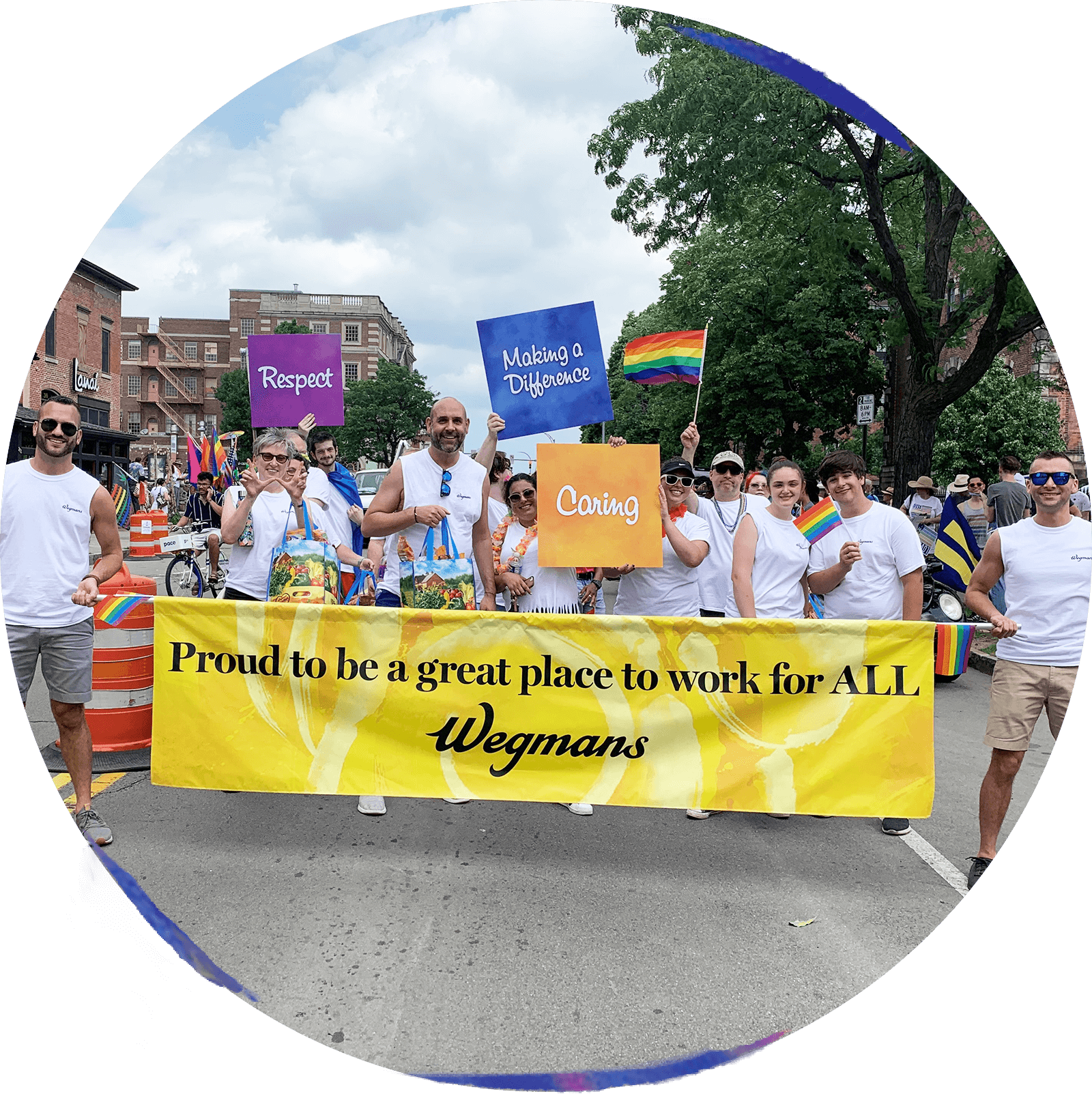 Wegmans employees and family marching in a Pride parade