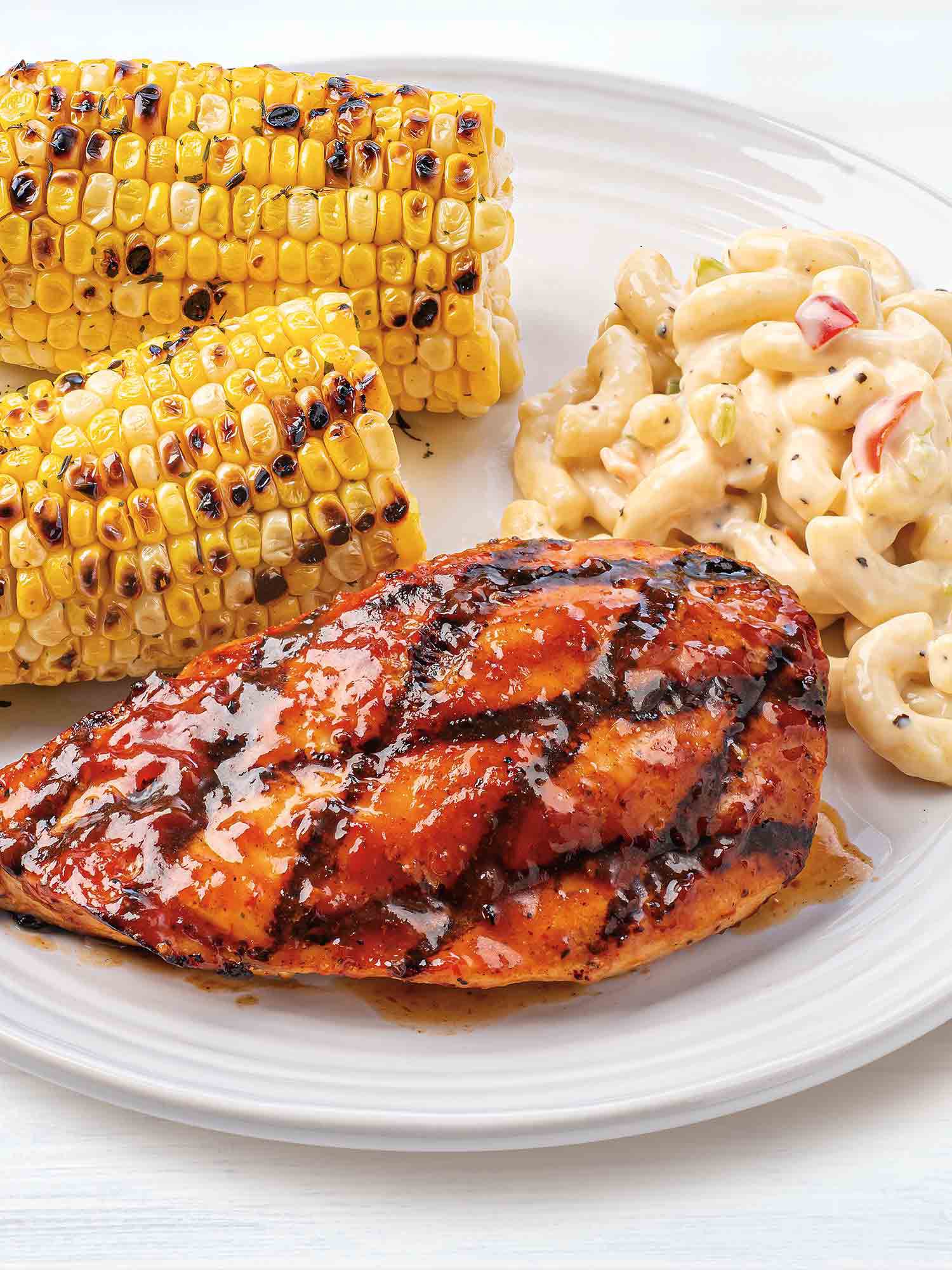 July 4th menu including Memphis barbecue chicken, grilled corn, and sides