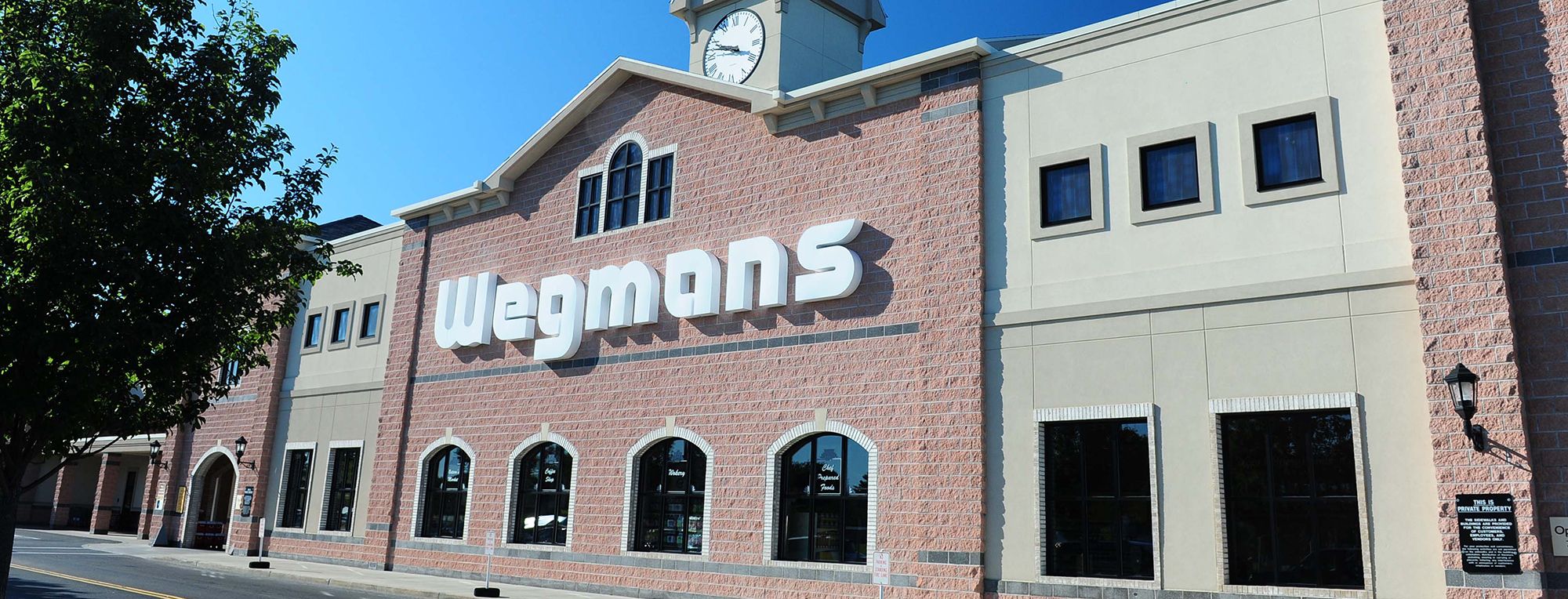 https://images.wegmans.com/is/image/wegmans/Wegmans_Store_Front_01_JohnGlenn_NY?wid=2000&hei=764