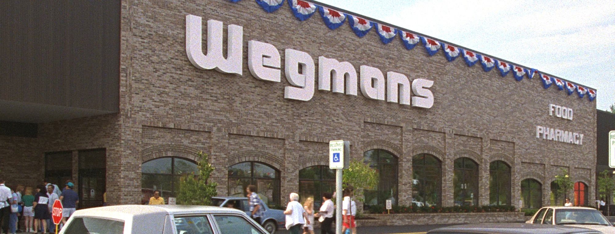 https://images.wegmans.com/is/image/wegmans/Wegmans_Store_Front_75_Erie_PA?wid=2000&hei=764