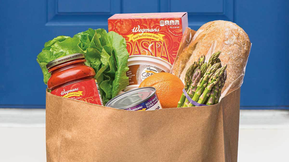bag of groceries on a front porch